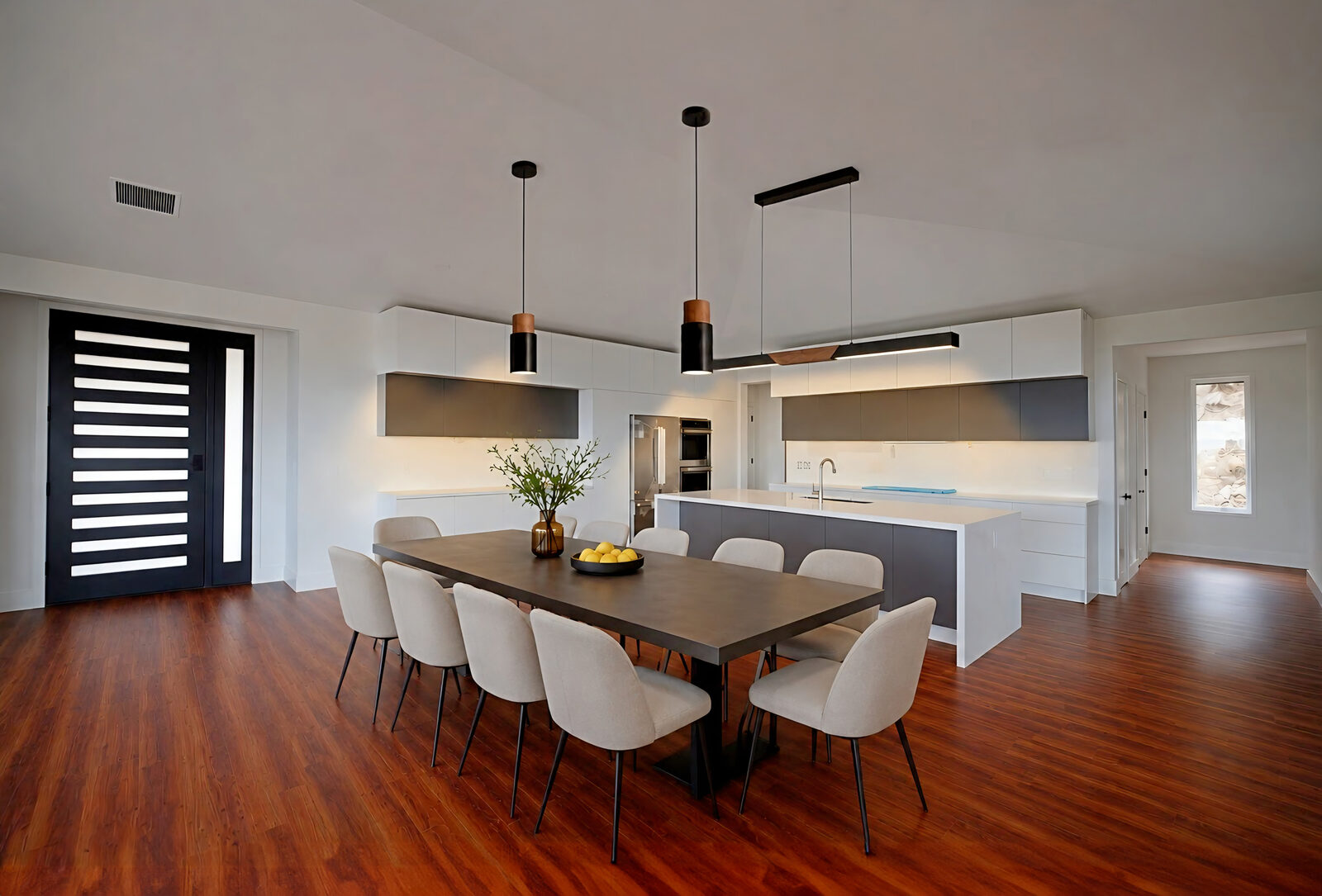 Dining area with pendant lighting and ocean view