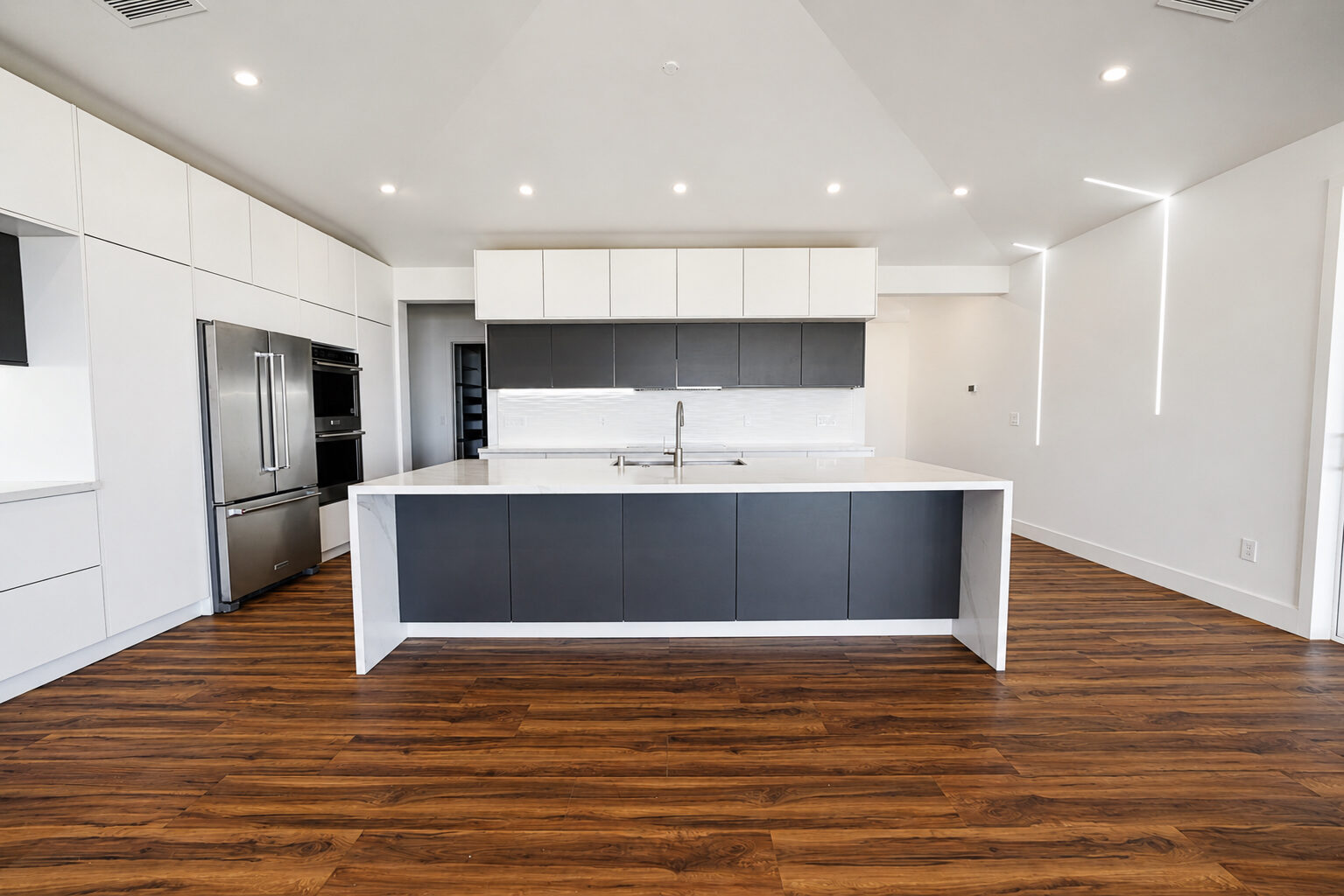 Kitchen with island seating and pendant lighting